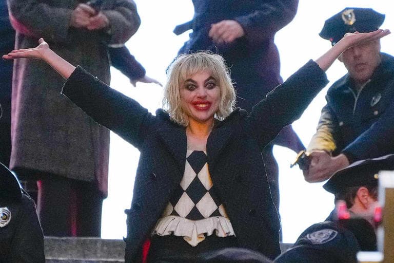 Lady Gaga as Harley Quinn with arms raised